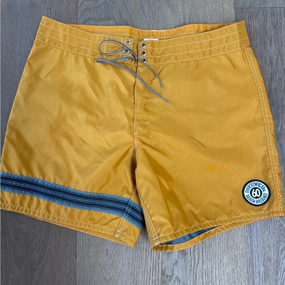 Mustard yellow BirdWell swim shorts with blue stripe